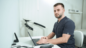 nutritionist sitting in front of his desk