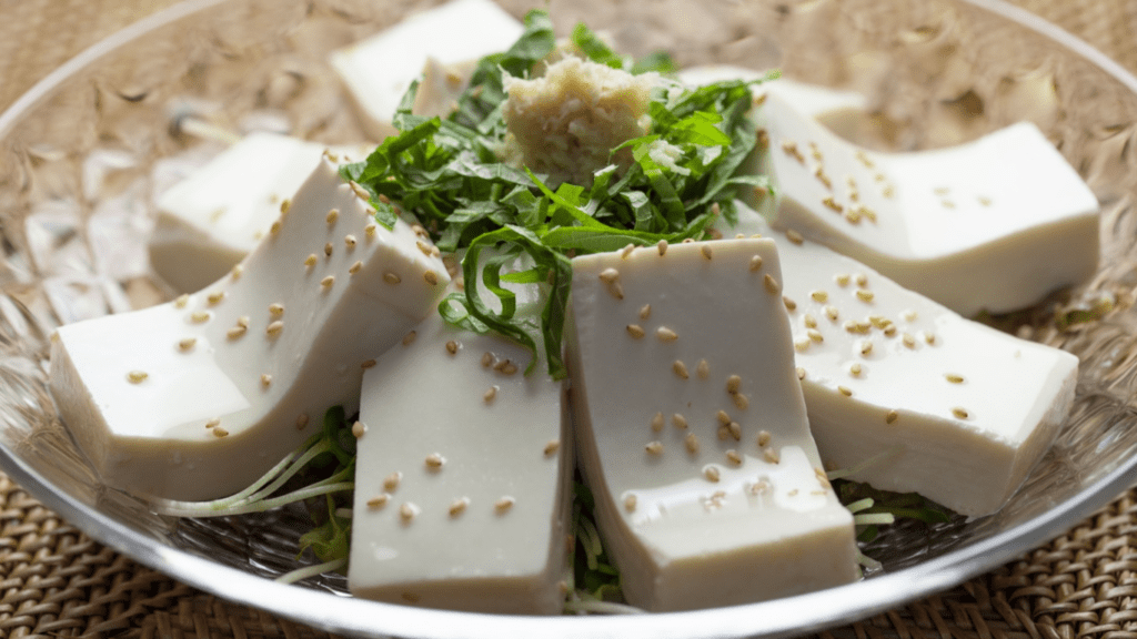 a bowl of tofu with sesame seeds on top