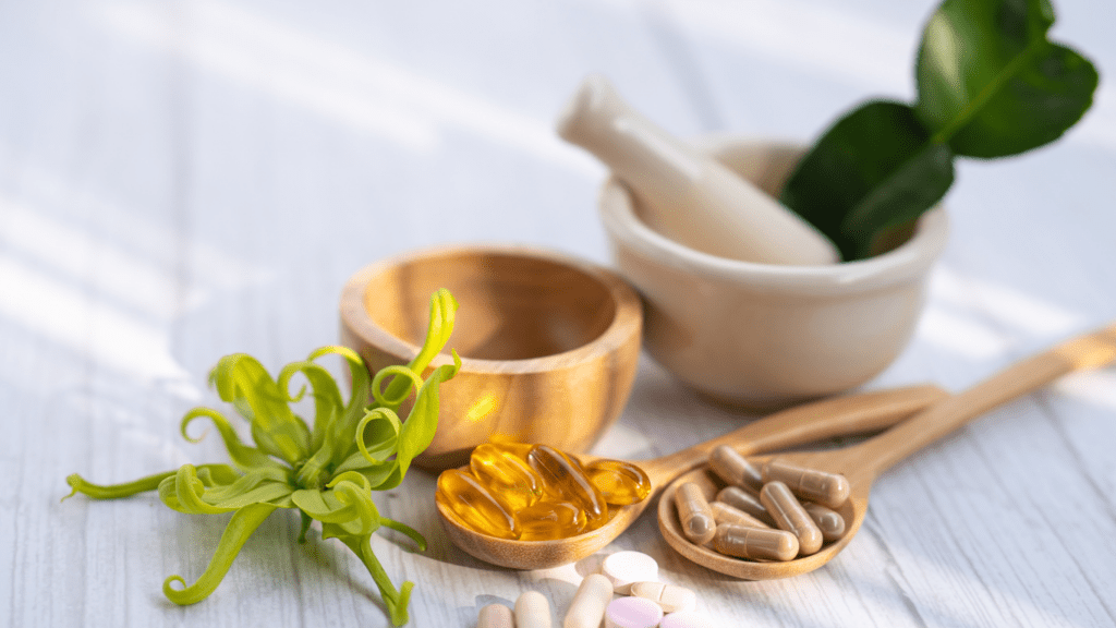 various vitamins and supplements on a wooden table