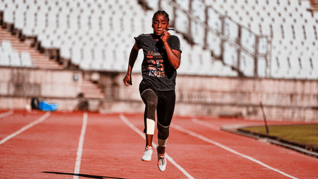 An athlete is running on a track