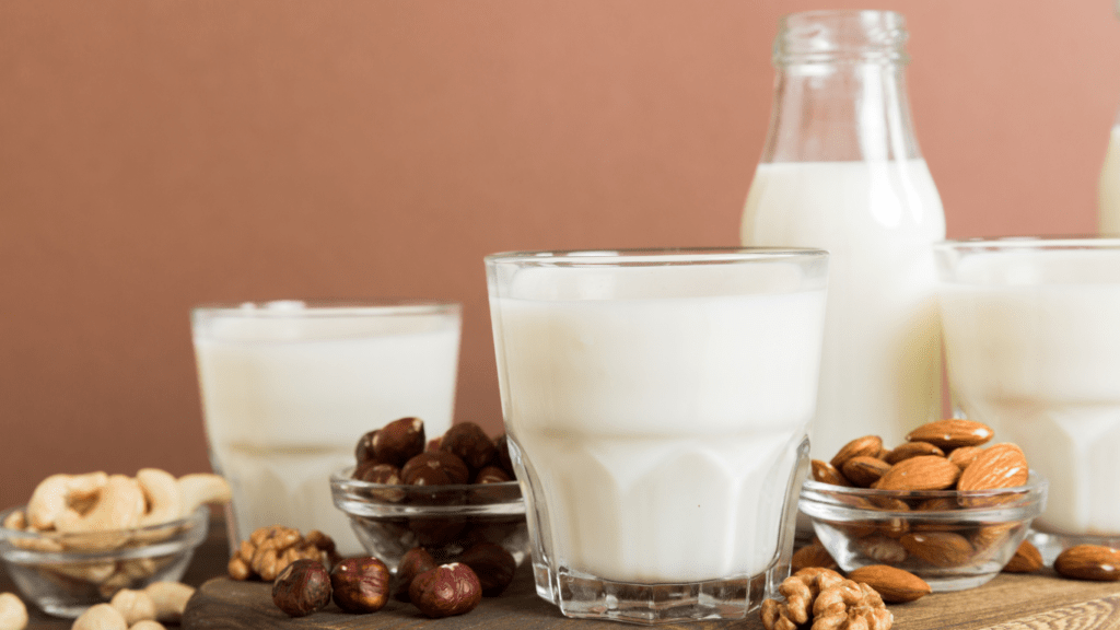 milk, nuts and other dairy products on a wooden table