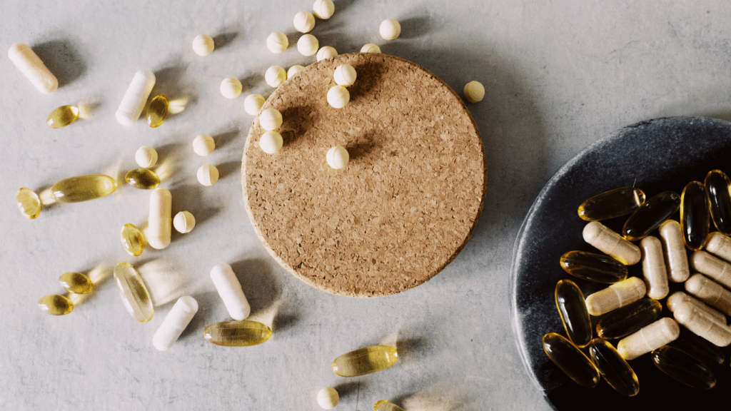 an assortment of vitamins and pills on a plate