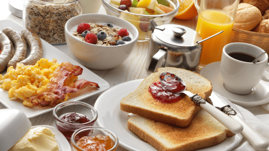 Various types of bread are arranged at the top of the table