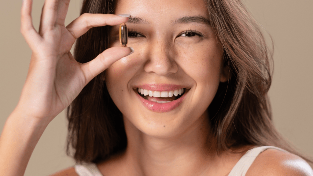 a beautiful person posing with their hand on their face