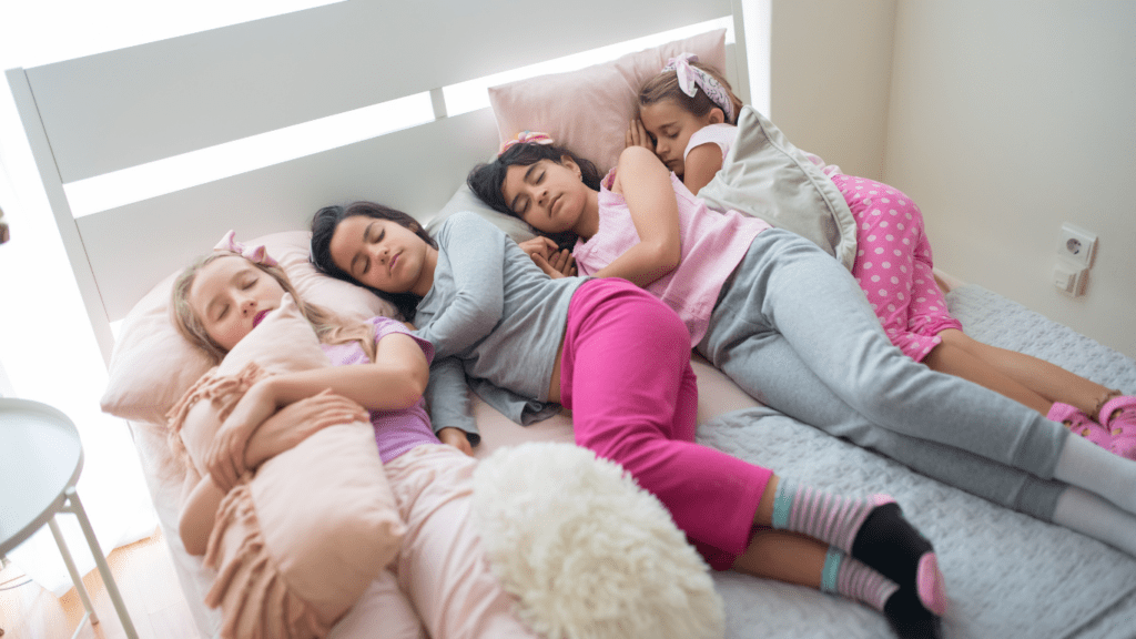 a group of people sleeping on their bed