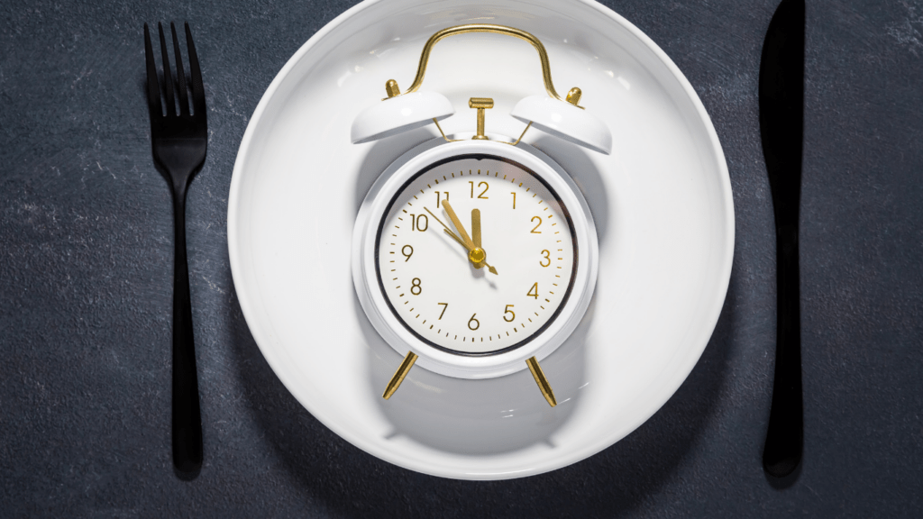 an alarm clock on a white plate on a blue background