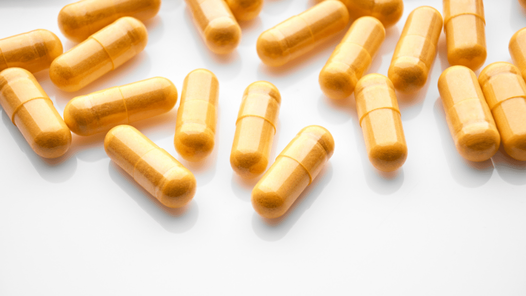 an assortment of vitamins and pills on a plate