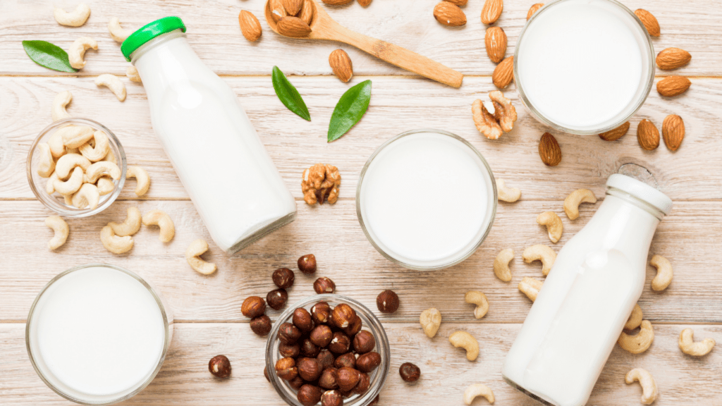 milk, nuts and other dairy products on a wooden table