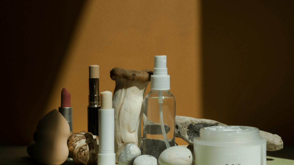 various skin care products laid out on a green surface