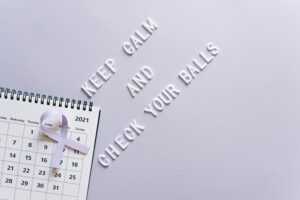 Cancer awareness concept with calendar and text reminder for self-check in minimalist style.